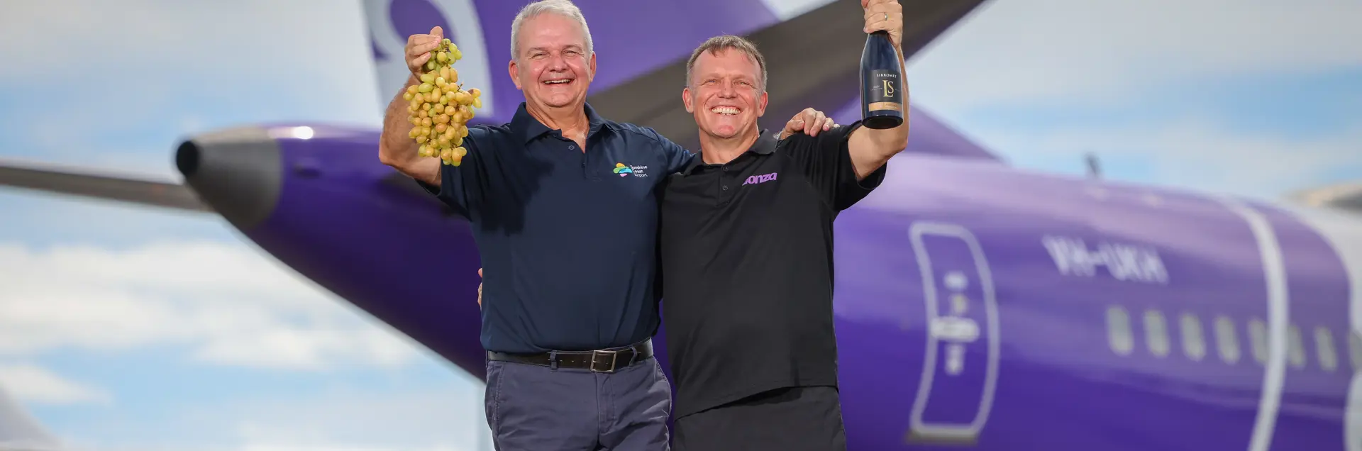 Bonza CEO stomping grapes in front of Bonza plane